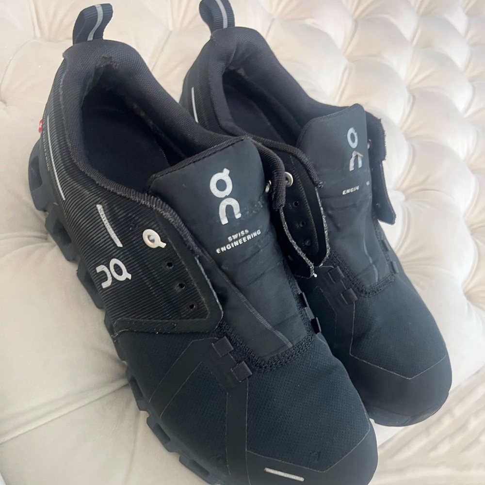 On Running Black Athletic Shoes with CloudTec Cushioning